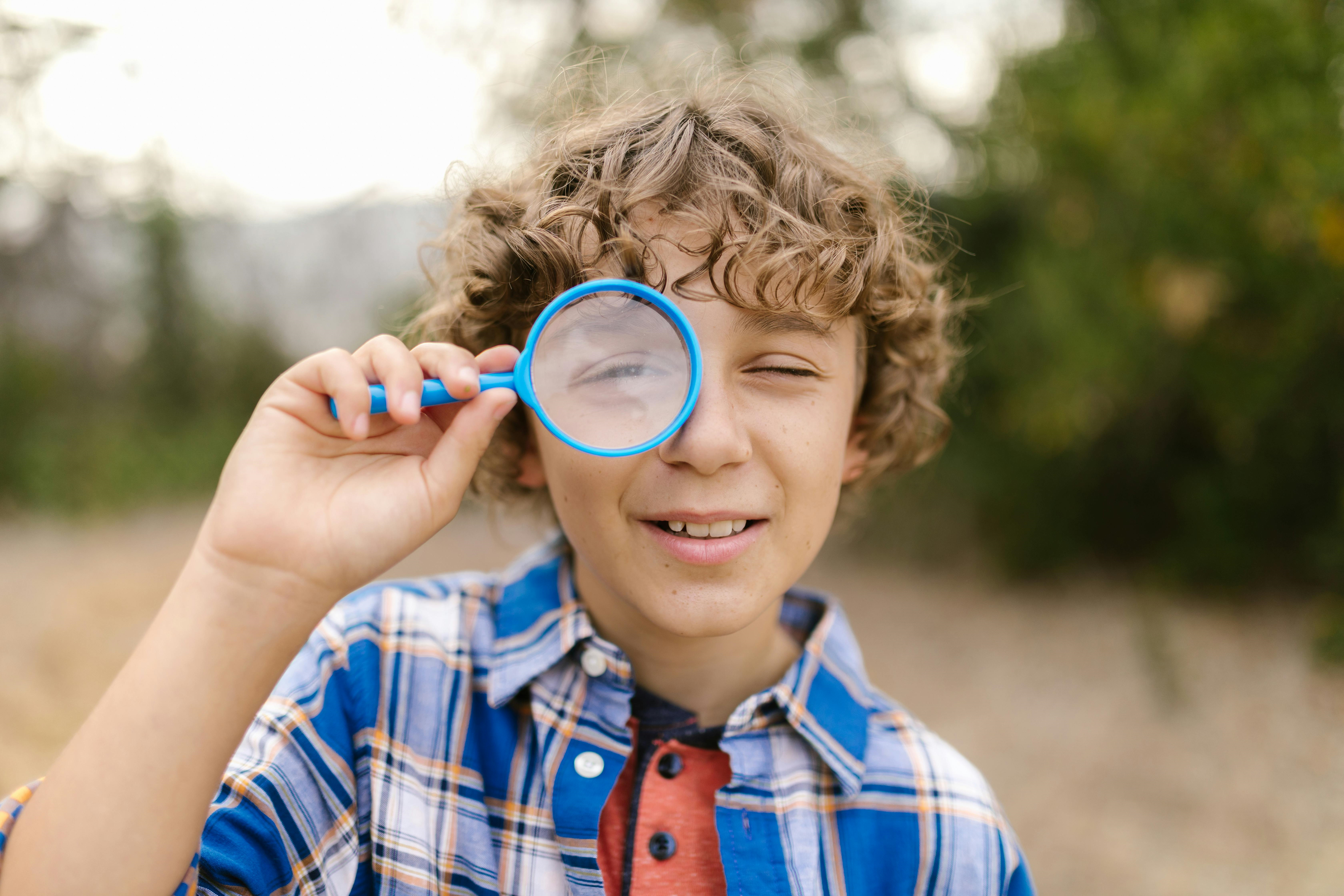 boy magnifying glass